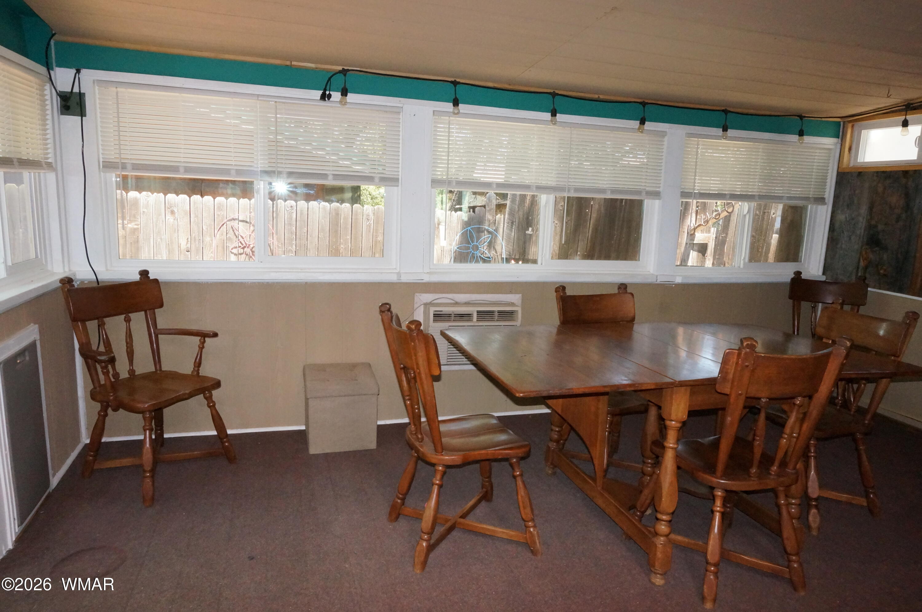 6066 Wagon Wheel Road Lakeside, AZ 85929 - Photo 21 of 32 a view of a dining room with furniture and window