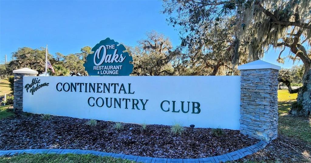 27 Robin Road Wildwood, FL 34785 - Photo 10 of 16 a sign that is next to a brick wall