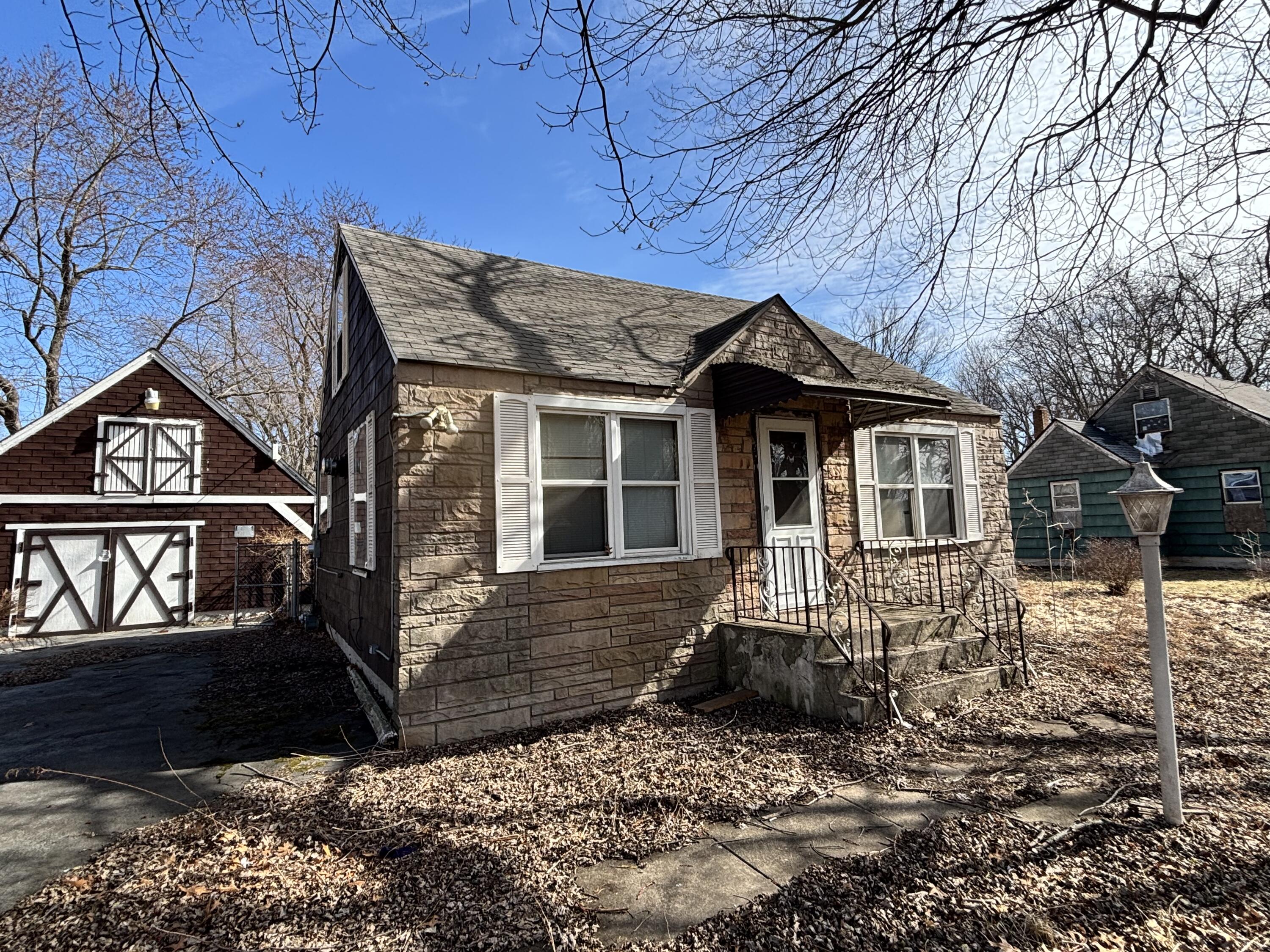 a front view of a house with yard