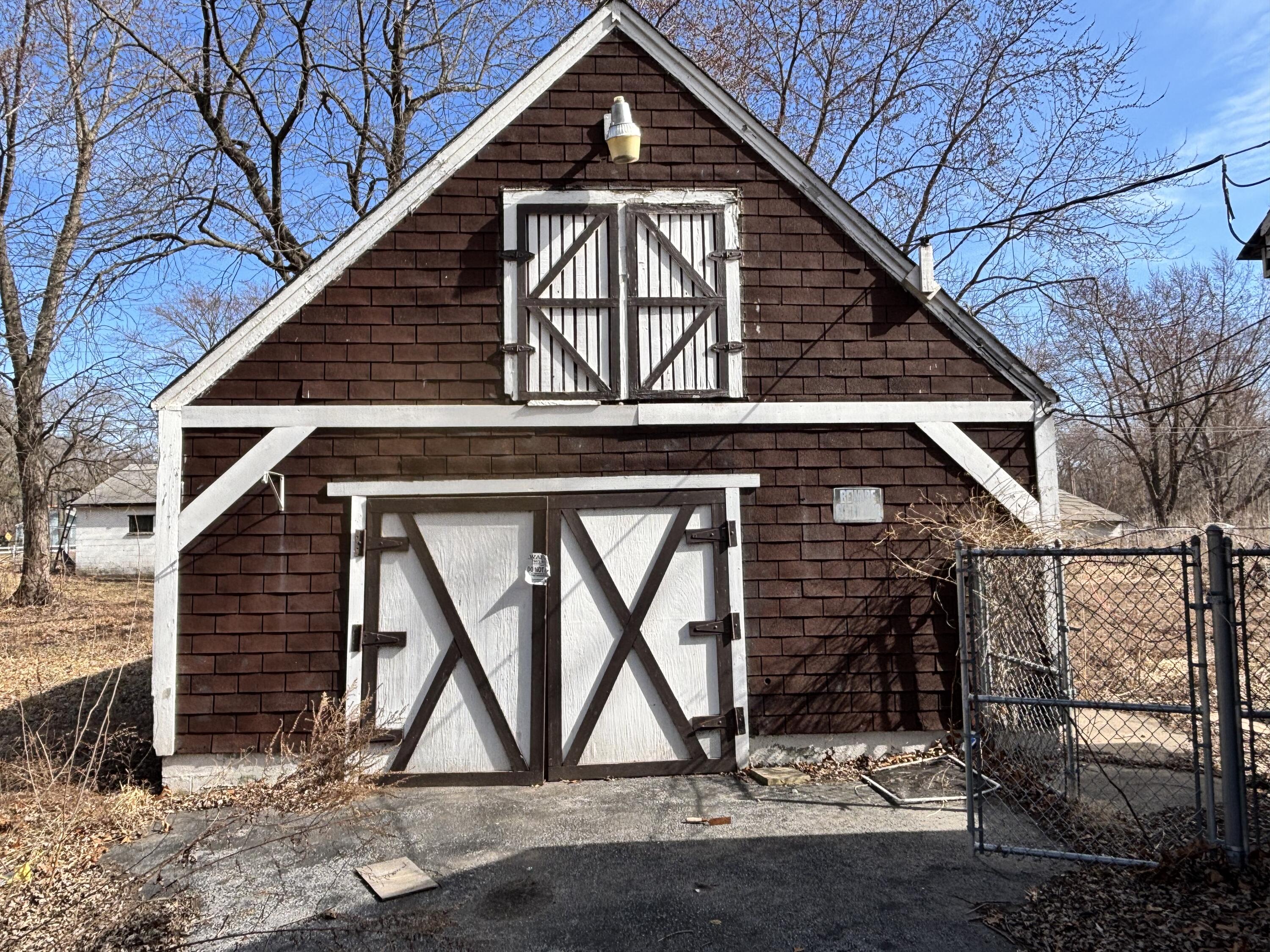 2407 Hanley Street Gary, IN 46406 - Photo 12 of 12 a front view of a house with garden