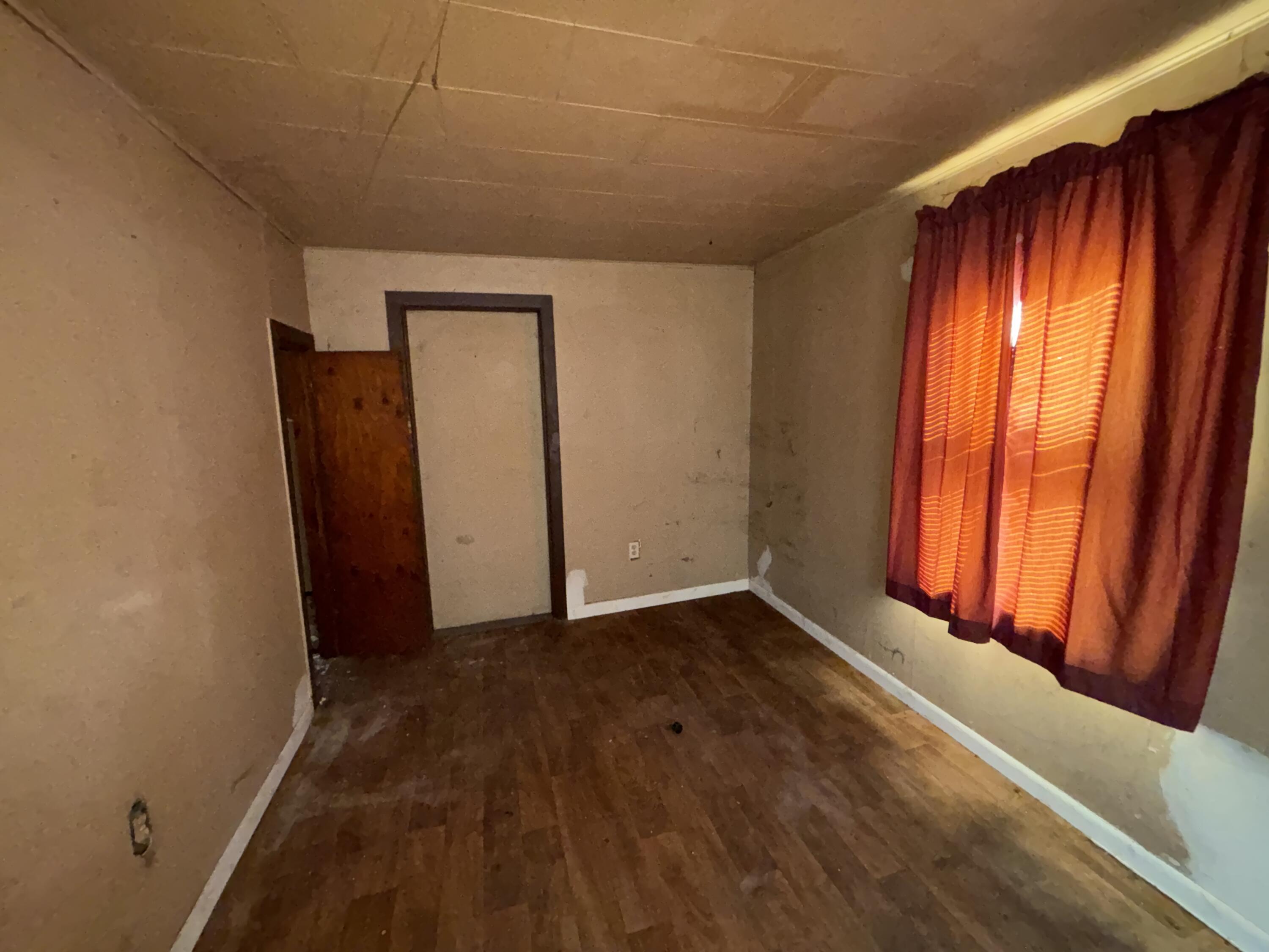 2407 Hanley Street Gary, IN 46406 - Photo 5 of 12 an empty room with windows