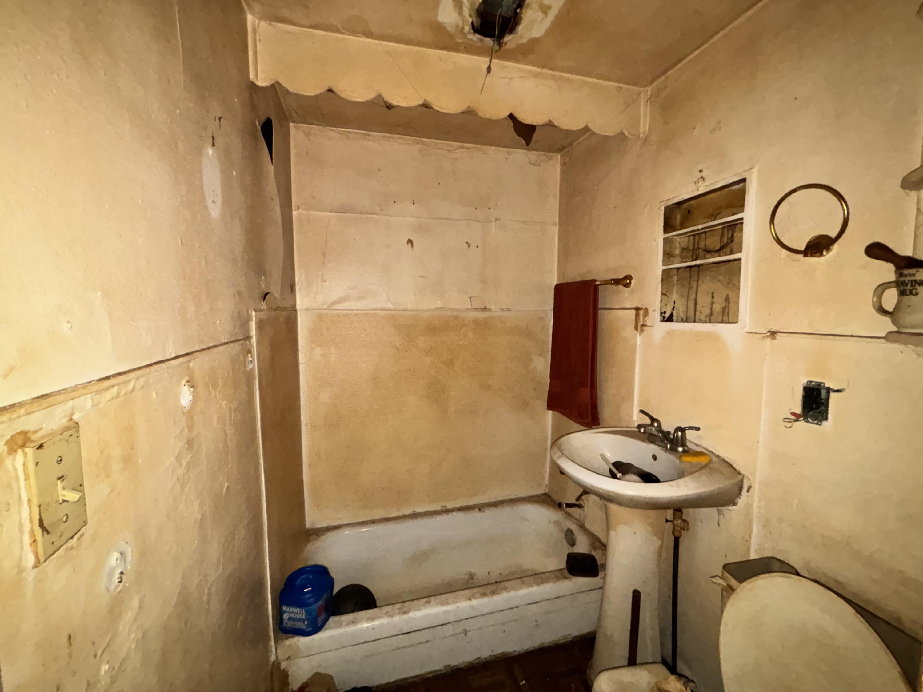 2407 Hanley Street Gary, IN 46406 - Photo 10 of 12 a bathroom with a sink toilet and shower