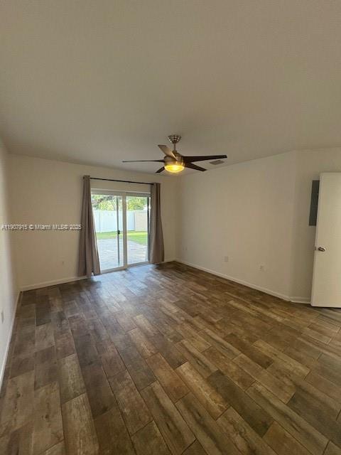 1141 Southwest 111th Way Davie, FL 33324 - Photo 11 of 19 wooden floor in an empty room with a window