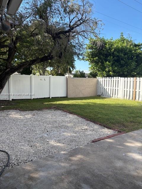 1141 Southwest 111th Way Davie, FL 33324 - Photo 18 of 19 a view of a yard with wooden fence