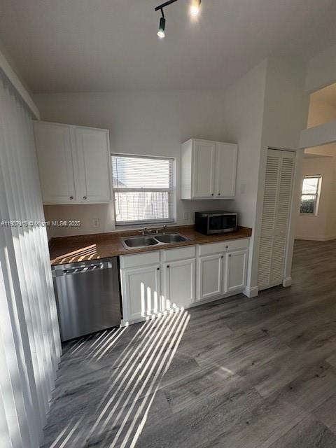 1141 Southwest 111th Way Davie, FL 33324 - Photo 4 of 19 a kitchen with granite countertop a refrigerator and a stove top oven