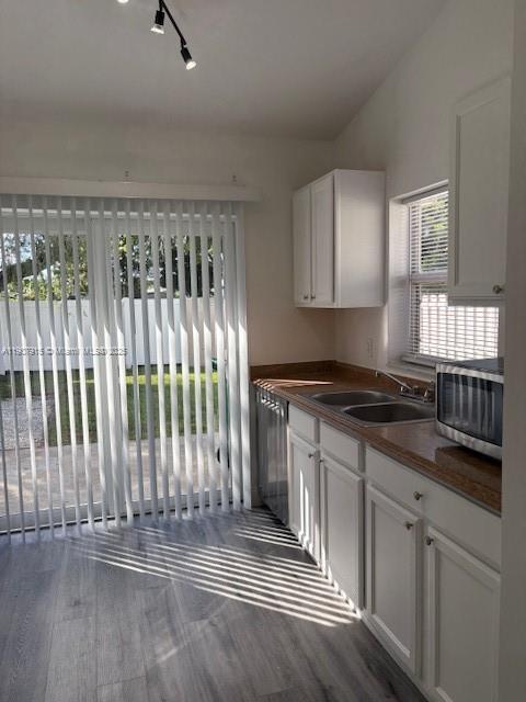 1141 Southwest 111th Way Davie, FL 33324 - Photo 6 of 19 a kitchen with granite countertop a stove a sink and a window