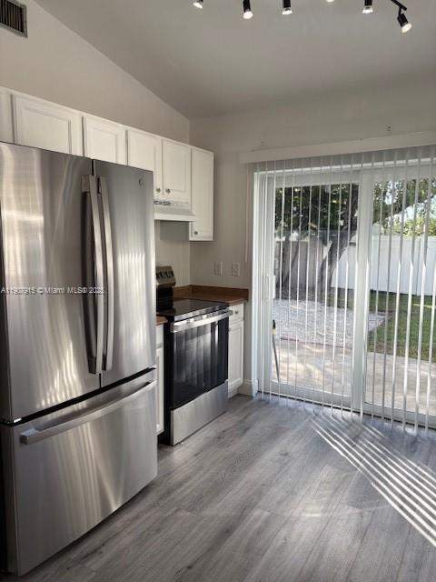 1141 Southwest 111th Way Davie, FL 33324 - Photo 7 of 19 a kitchen with stainless steel appliances wooden floor and fence