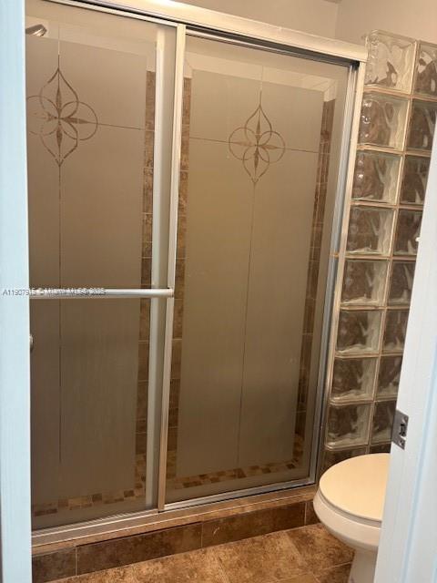 1141 Southwest 111th Way Davie, FL 33324 - Photo 9 of 19 a bathroom with a shower and a toilet