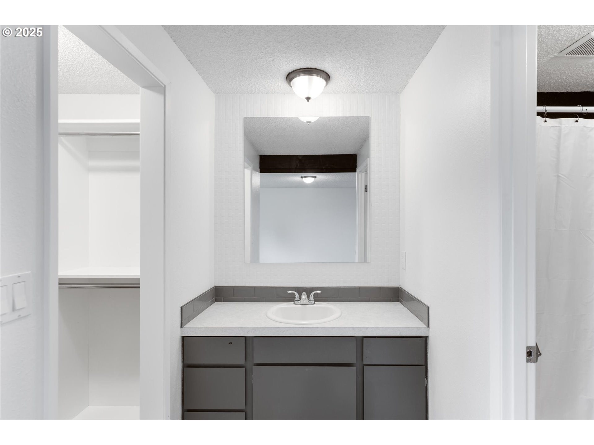 9 Lee Place Longview, WA 98632 - Photo 29 of 46 a bathroom with a sink and a mirror