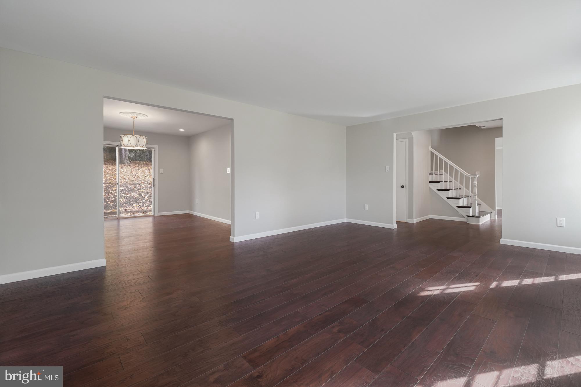 12539 Heurich Road Silver Spring, MD 20902 - Photo 5 of 46 a view of an empty room with wooden floor