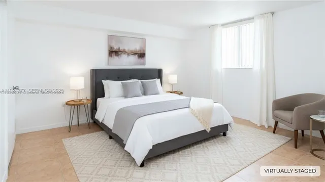 a bedroom with a bed and chair