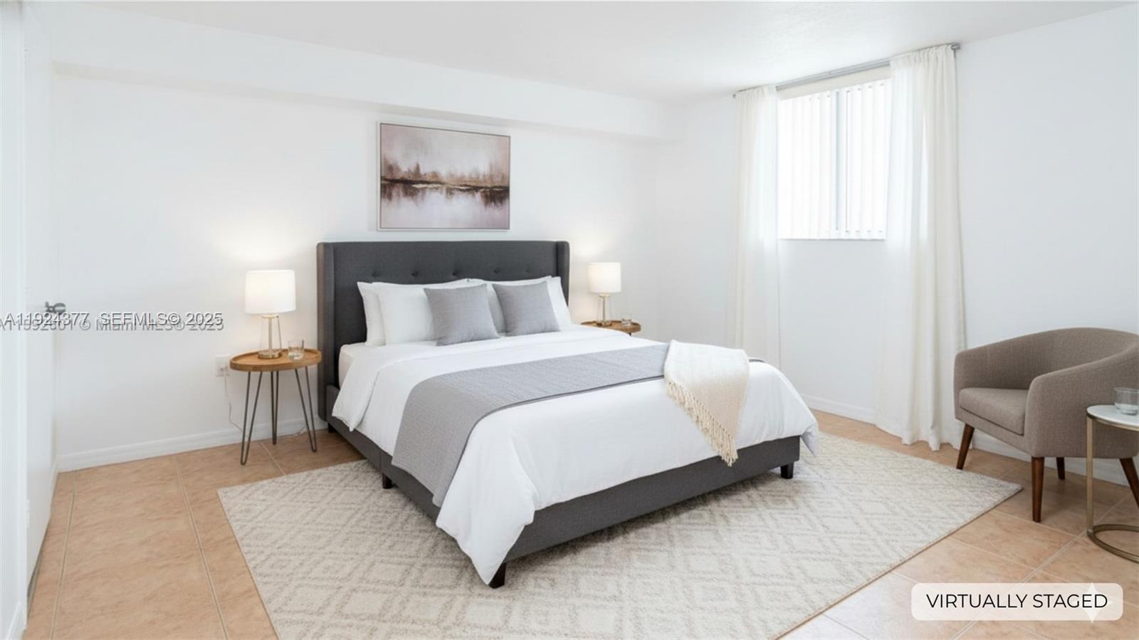 102 Southwest 6th Avenue, Unit 401 Miami, FL 33130 - Photo 8 of 15 a bedroom with a bed and chair