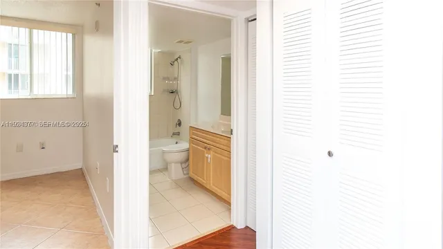 a view of a bathroom with a bathtub and a toilet