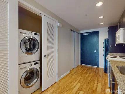 a bedroom with a washer and dryer