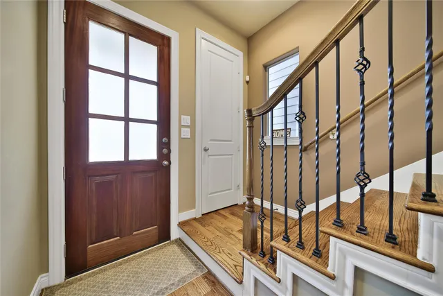 view of an entryway with wooden floor and door