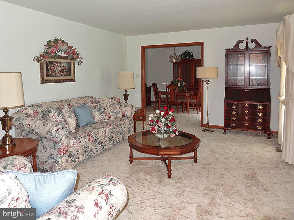 1200 Parran Road St. Leonard, MD 20685 - Photo 14 of 29 a living room with furniture and a couch