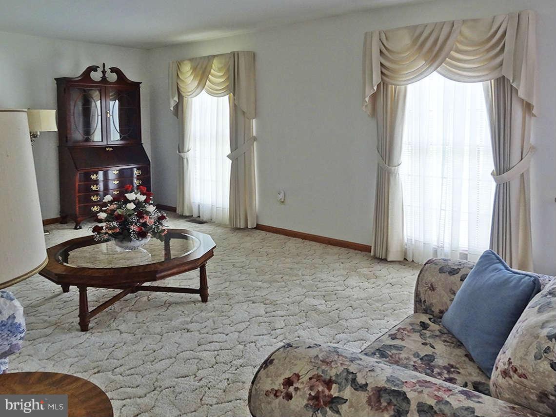 1200 Parran Road St. Leonard, MD 20685 - Photo 15 of 29 a living room with furniture and a large window