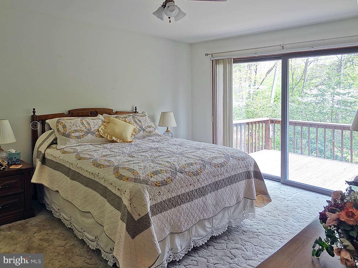 1200 Parran Road St. Leonard, MD 20685 - Photo 20 of 29 a bedroom with a bed and a window