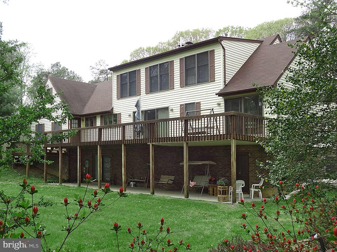 1200 Parran Road St. Leonard, MD 20685 - Photo 3 of 29 a view of an house with backyard space and garden