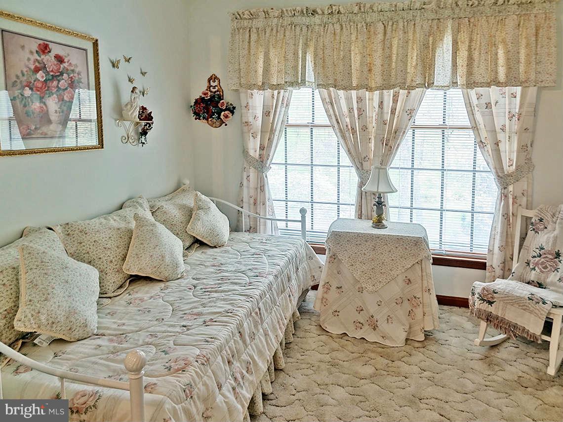 1200 Parran Road St. Leonard, MD 20685 - Photo 21 of 29 a bedroom with a bed and a window