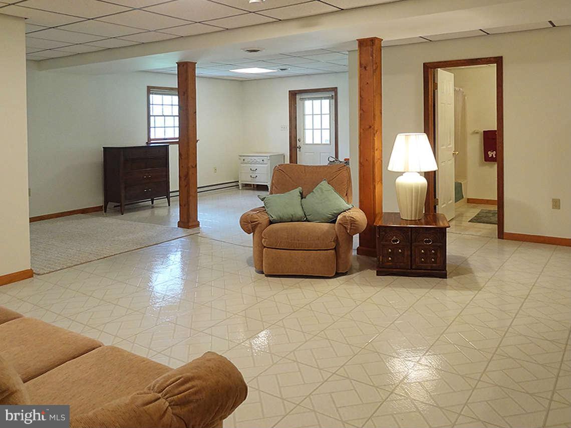 1200 Parran Road St. Leonard, MD 20685 - Photo 29 of 29 a living room with furniture and a window