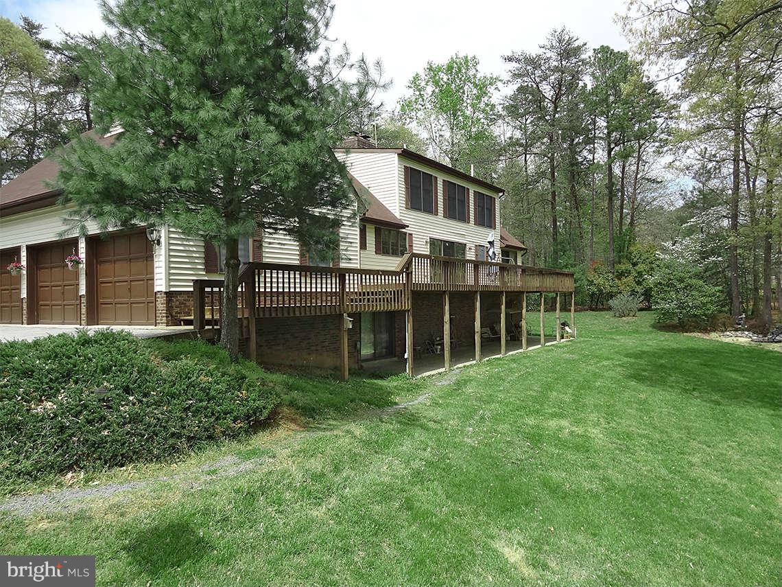 1200 Parran Road St. Leonard, MD 20685 - Photo 10 of 29 a view of a house with a yard and sitting area