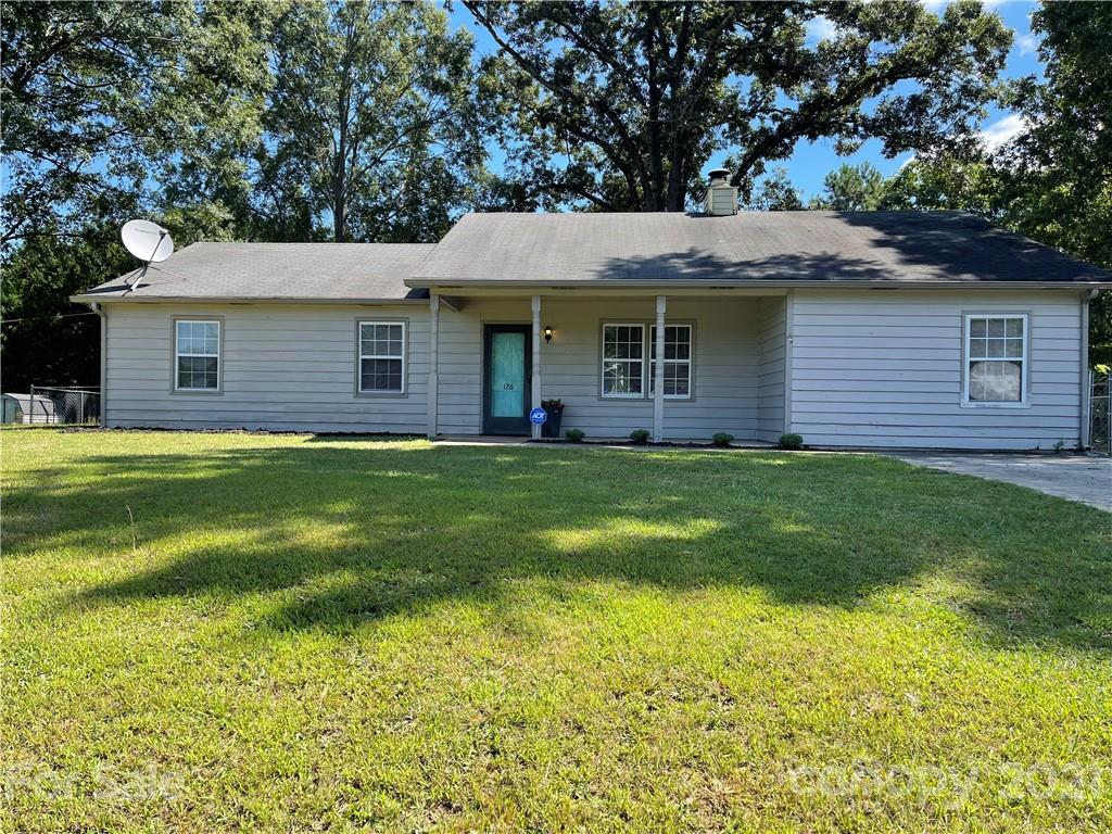 126 Sparrow Road Statesville, NC 28625 - Photo 1 of 29 a view of a house with a yard and sitting area