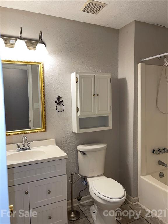 126 Sparrow Road Statesville, NC 28625 - Photo 13 of 29 a bathroom with a sink a toilet and shower