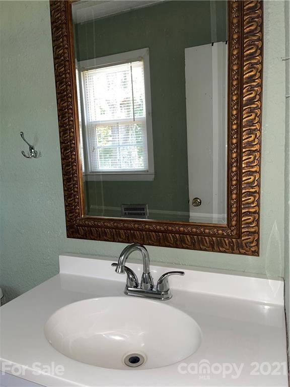 126 Sparrow Road Statesville, NC 28625 - Photo 14 of 29 a bathroom with a bathtub and a sink