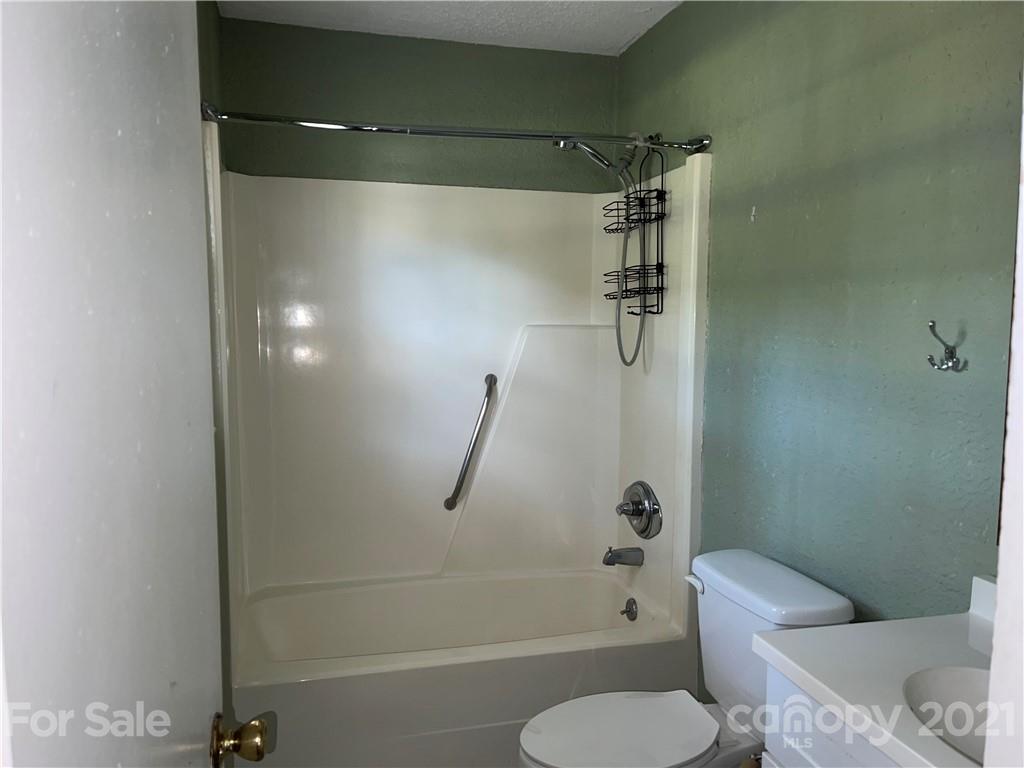 126 Sparrow Road Statesville, NC 28625 - Photo 15 of 29 a bathroom with a shower and toilet