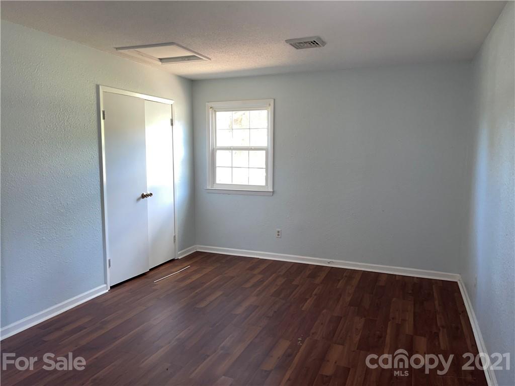 126 Sparrow Road Statesville, NC 28625 - Photo 23 of 29 an empty room with wooden floor and windows