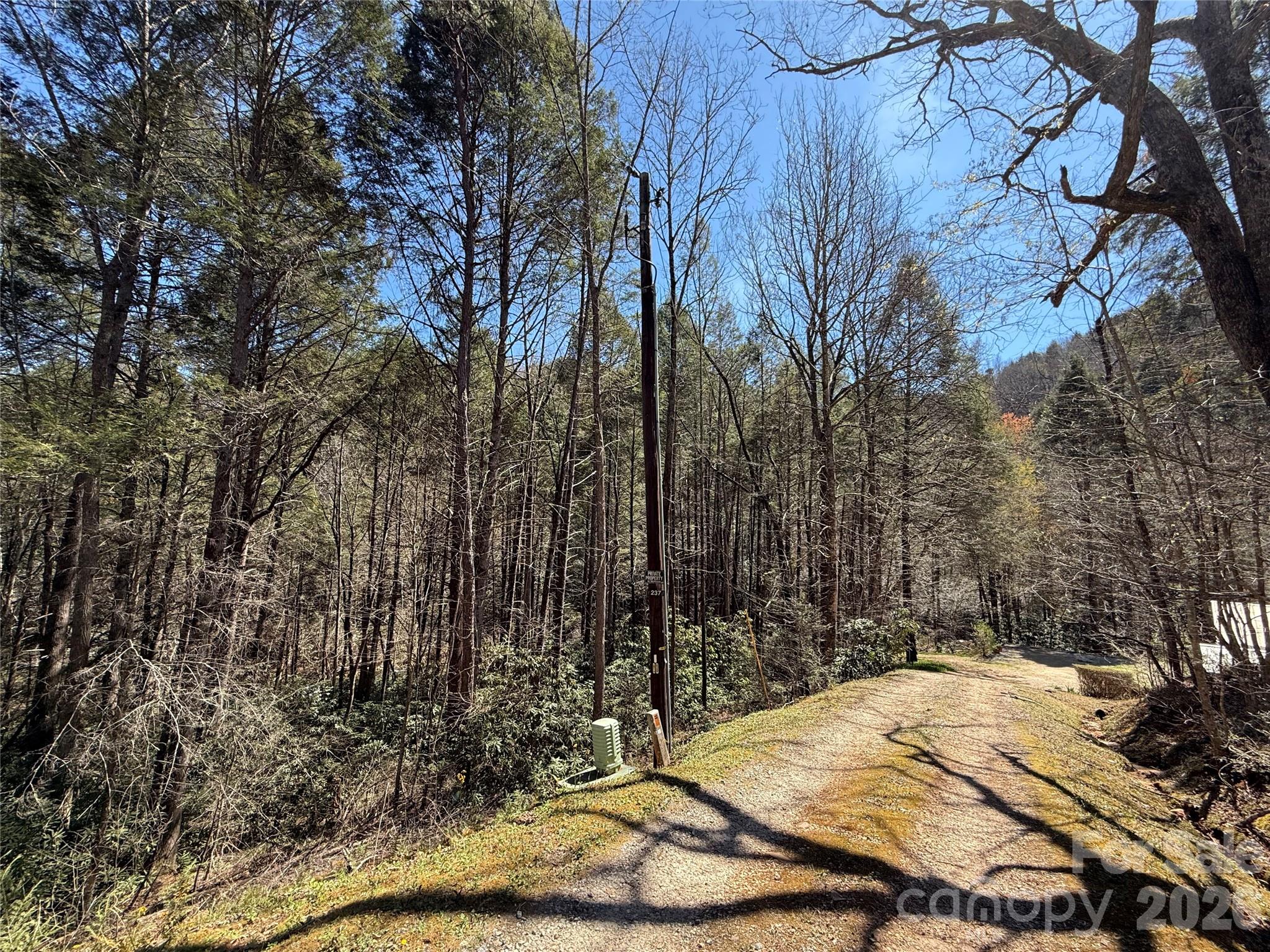 0 Kings Glen Road Old Fort, NC 28762 - Photo 45 of 47 a wooden bench with trees in the background