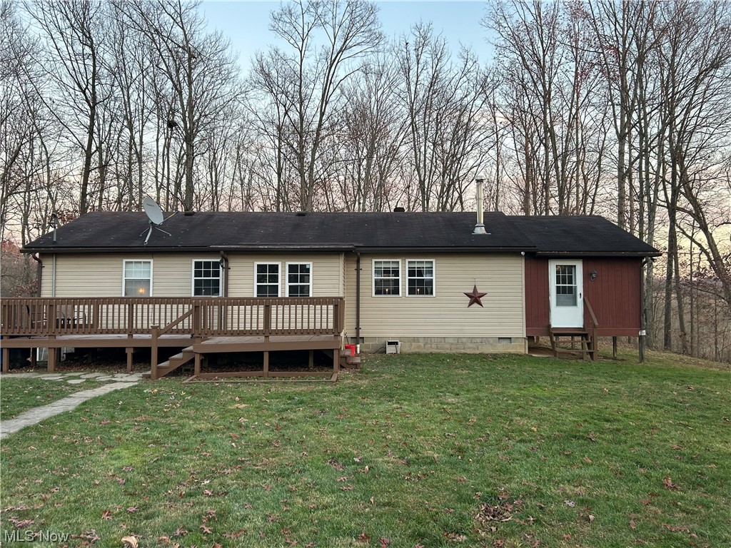 50748 Shenandoah Road Caldwell, OH 43724 - Photo 1 of 43 Front view of house featuring a yard and a deck
