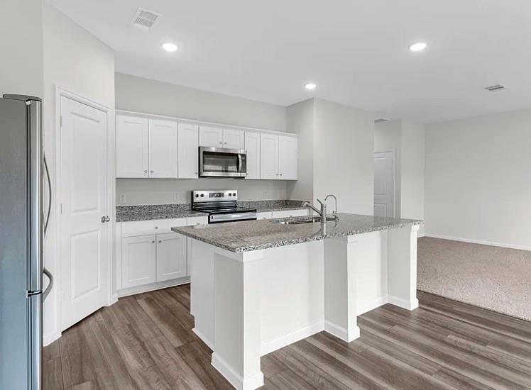 2012 Prairie Lane Melissa, TX 75454 - Photo 19 of 24 a kitchen with stainless steel appliances a refrigerator stove and microwave