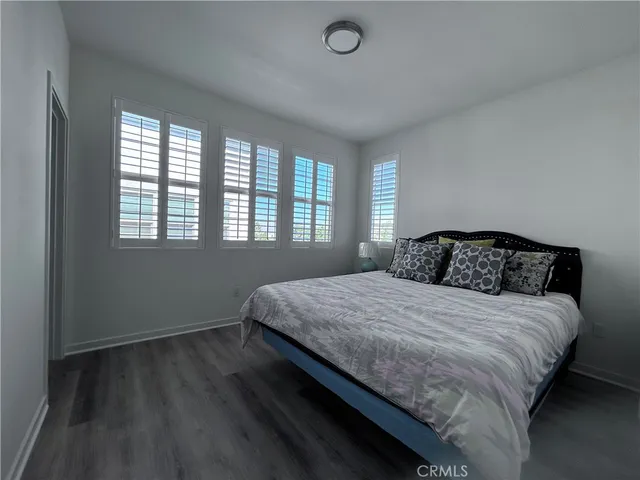 a bedroom with bed and window