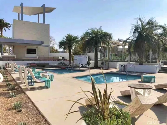 a view of a swimming pool with a patio