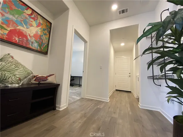 a view of a bedroom with furniture and clothes