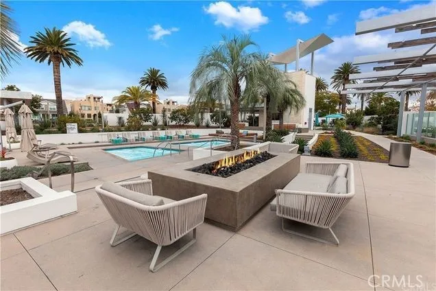 a view of a swimming pool and lounge chairs