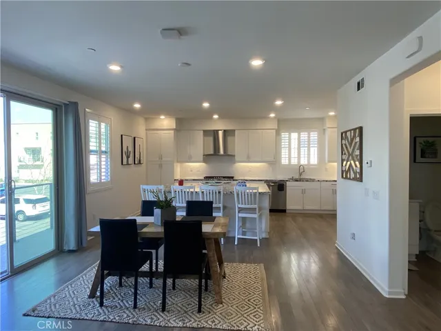 a kitchen with a table and chairs in it