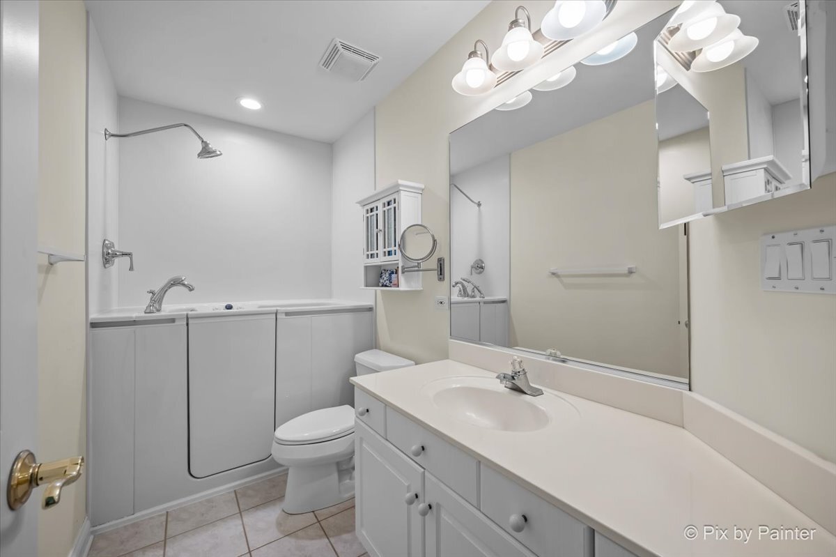 20 Lochbrook Lane Inverness, IL 60010 - Photo 11 of 27 a bathroom with a sink a toilet and a mirror