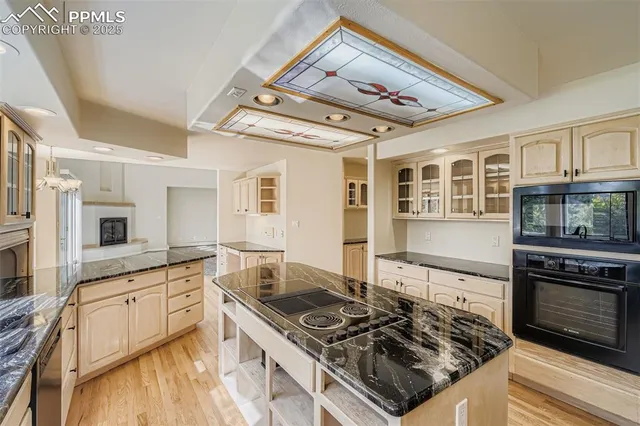 a kitchen with stainless steel appliances granite countertop a stove and a sink