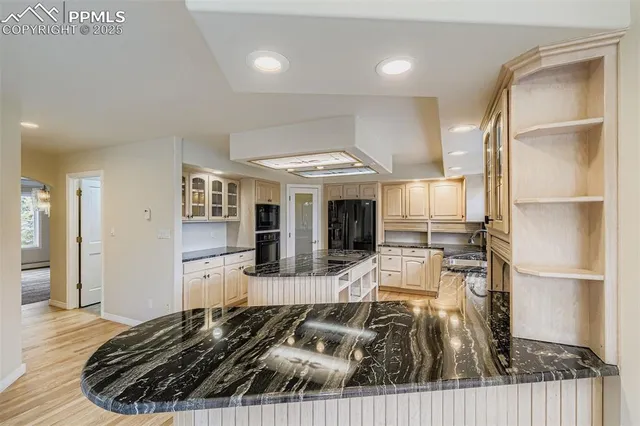 a view of a living room and kitchen
