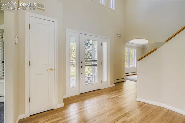 a view of entryway with wooden floor