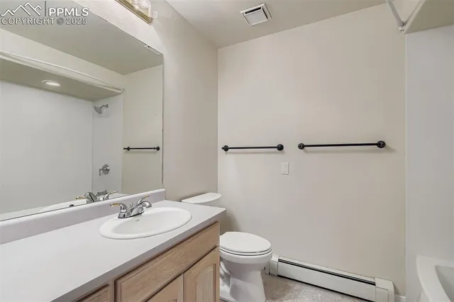 a bathroom with a sink toilet and vanity