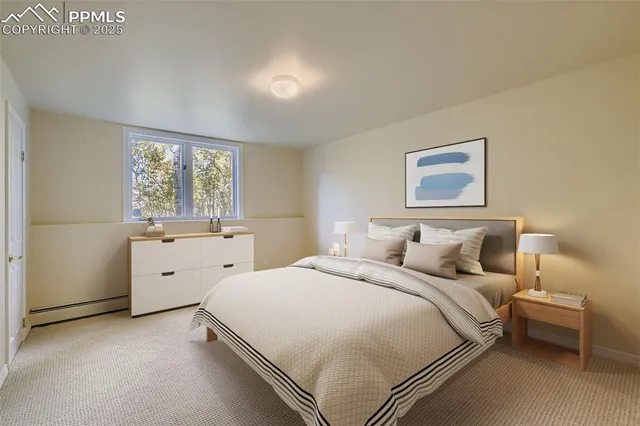 a bed room with a bed and a painting