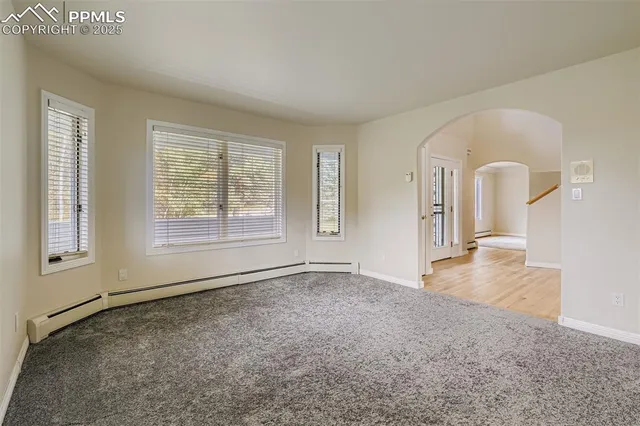 an empty room with windows