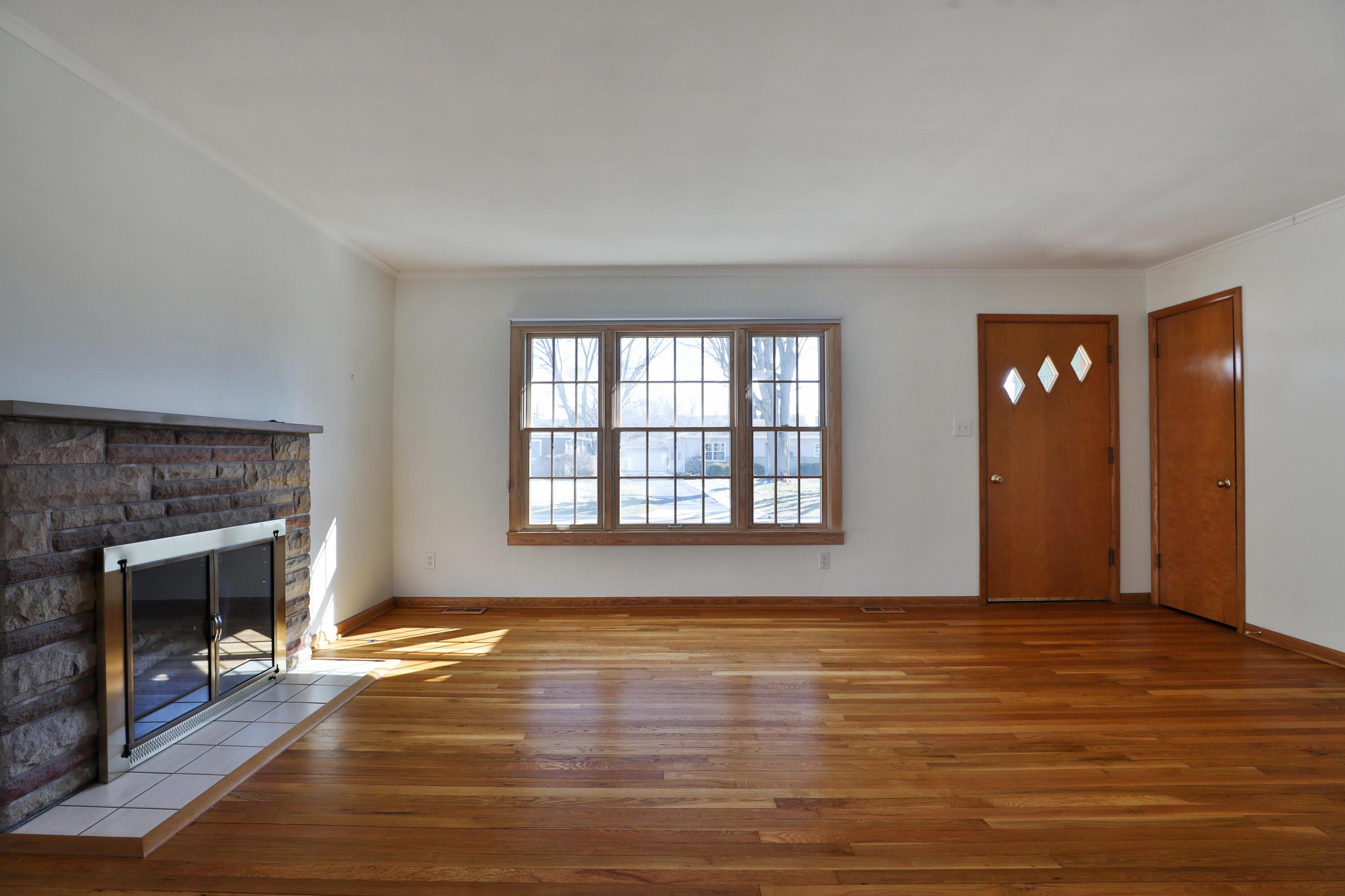 3231 Somerford Road Columbus, OH 43221 - Photo 3 of 35 Gleaming Hardwood Floors and stone Wood burning Fireplace