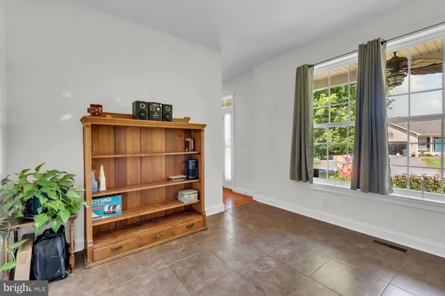 a bedroom with a bed and a desk