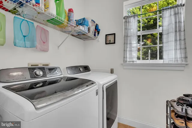 a bedroom with a bed and a ceiling fan