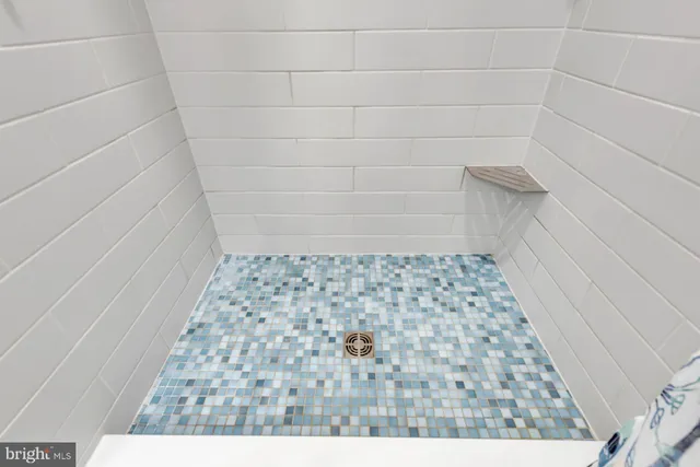 a bedroom with a large bed and a large window with the outer view